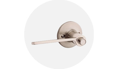Kwikset Palmina Collection Lever product isolated on top of a gray circle